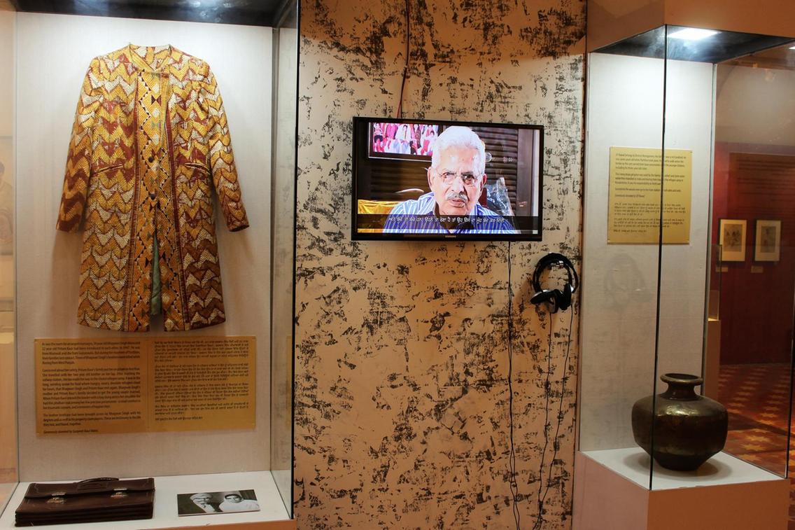 Phulkari coat &amp; briefcase, and water pot